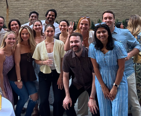 Media.net team members posing together during a party.